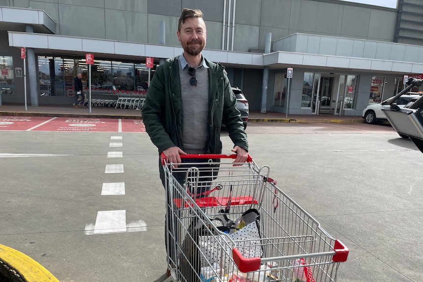 Adam Coad with a shopping trolley.