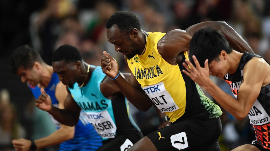 Usain Bolt sets off from the starting blocks.