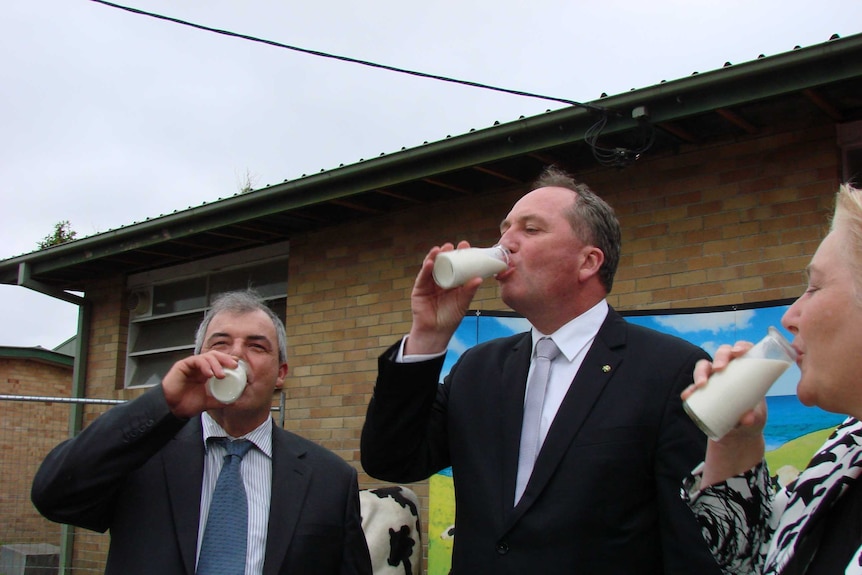 Politicians drinking milk.