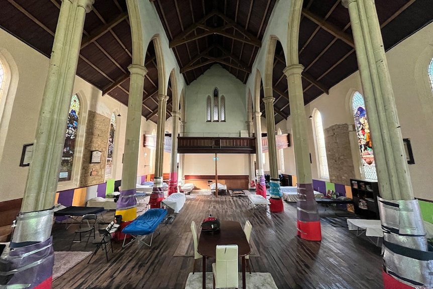 Sleeping stretchers in a church space.