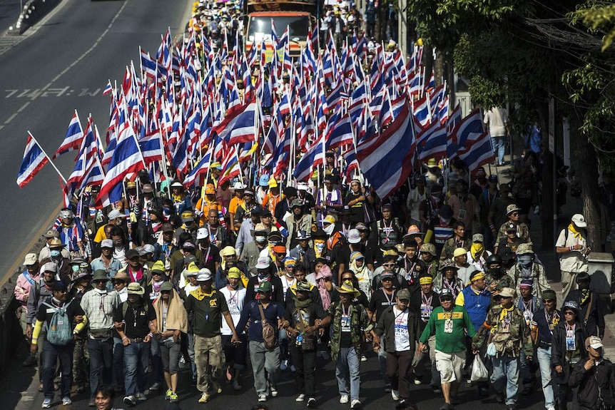 Anti-government protesters march during a rally in Bangkok