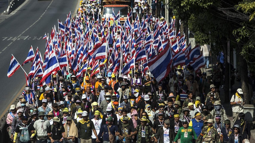 Anti-government protesters march during a rally in Bangkok
