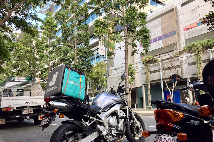 Food delivery box on a scooter.