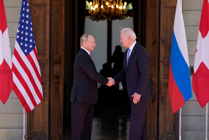 President Joe Biden and Russian President Vladimir Putin, shake hands at the 'Villa la Grange'