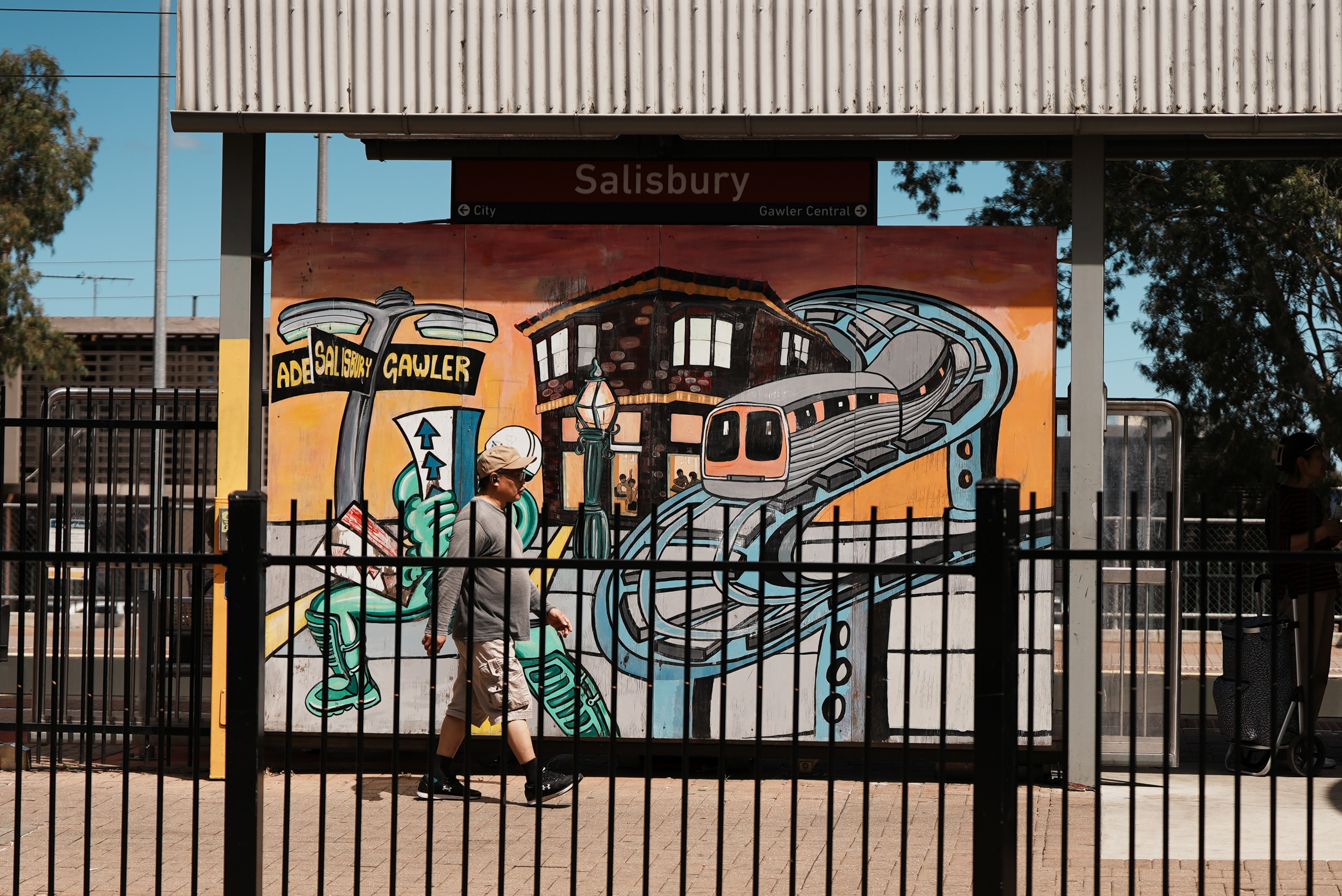 A man walks past a bus stop at Salibury