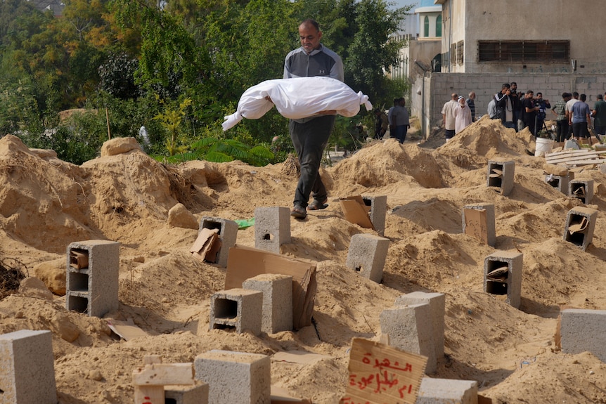Palestinians bury the bodies of their relatives killed in the Israeli bombardment of the Gaza Strip.
