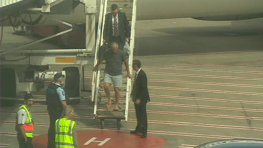 Chris Dawson arrives in Sydney to face murder charges