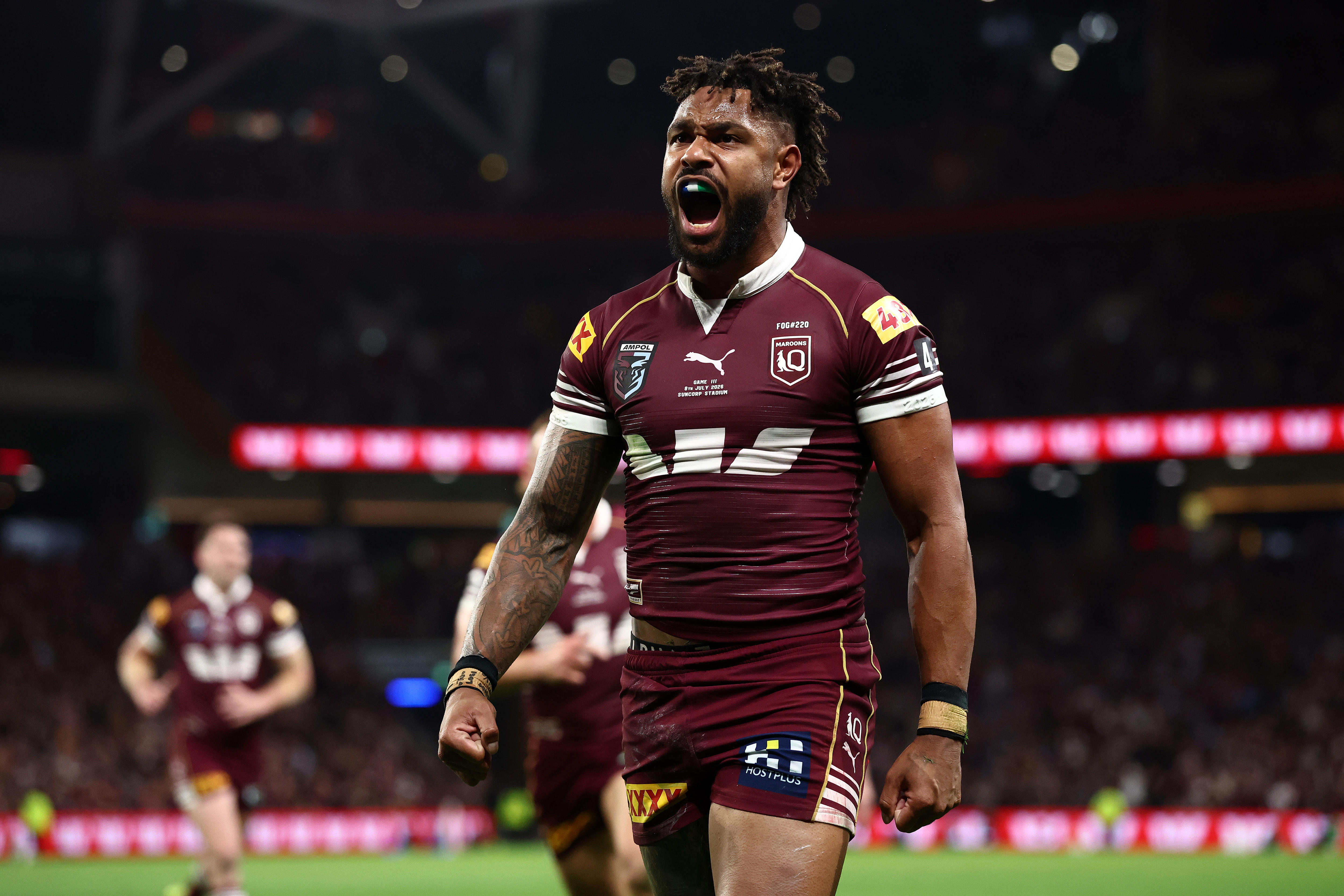 Hamiso Tabuai-Fidow celebrates a State of Origin try.