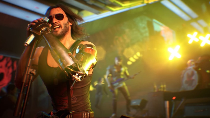 A still from the 2020 videogame Cyberpunk 2077 of Keanu Reeves playing frontman of fictional band Samurai