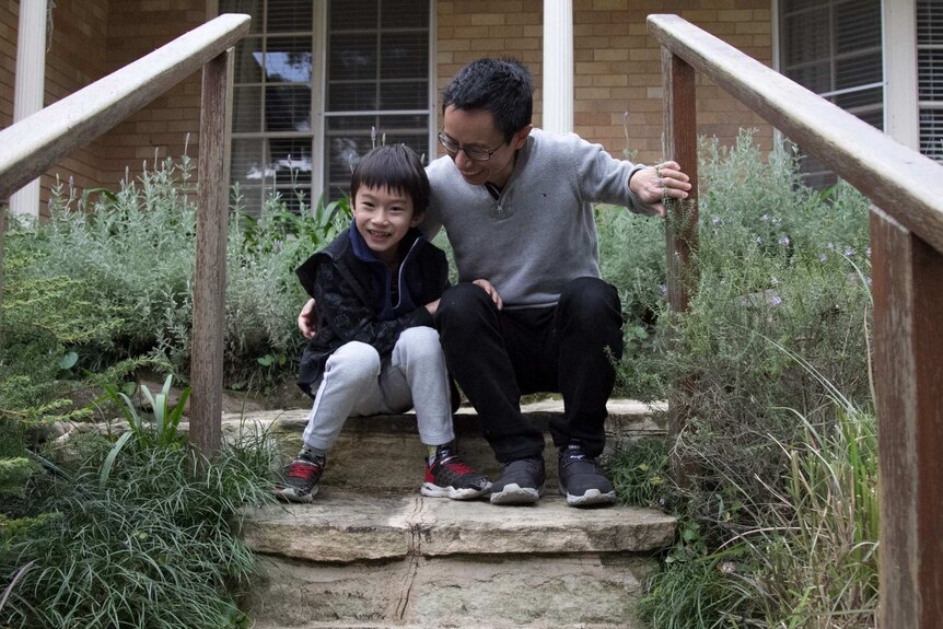 Aaron and Lucas Cheang outside their home in Killara
