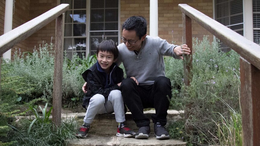 Aaron and Lucas Cheang outside their home in Killara