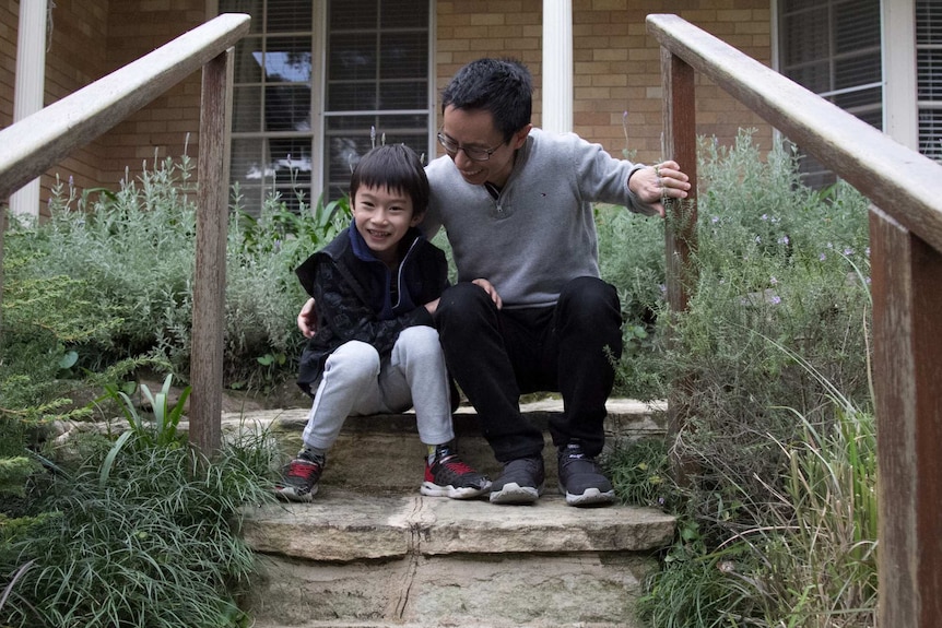 Aaron and Lucas Cheang outside their home in Killara