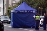 a police tent set up at tamarama where they are investigating the death of a man on sunday morning