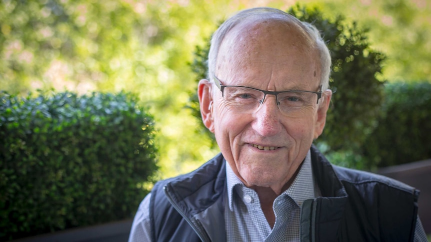 A portrait of a smiling older man, Associate Professor Murray Littlejohn.