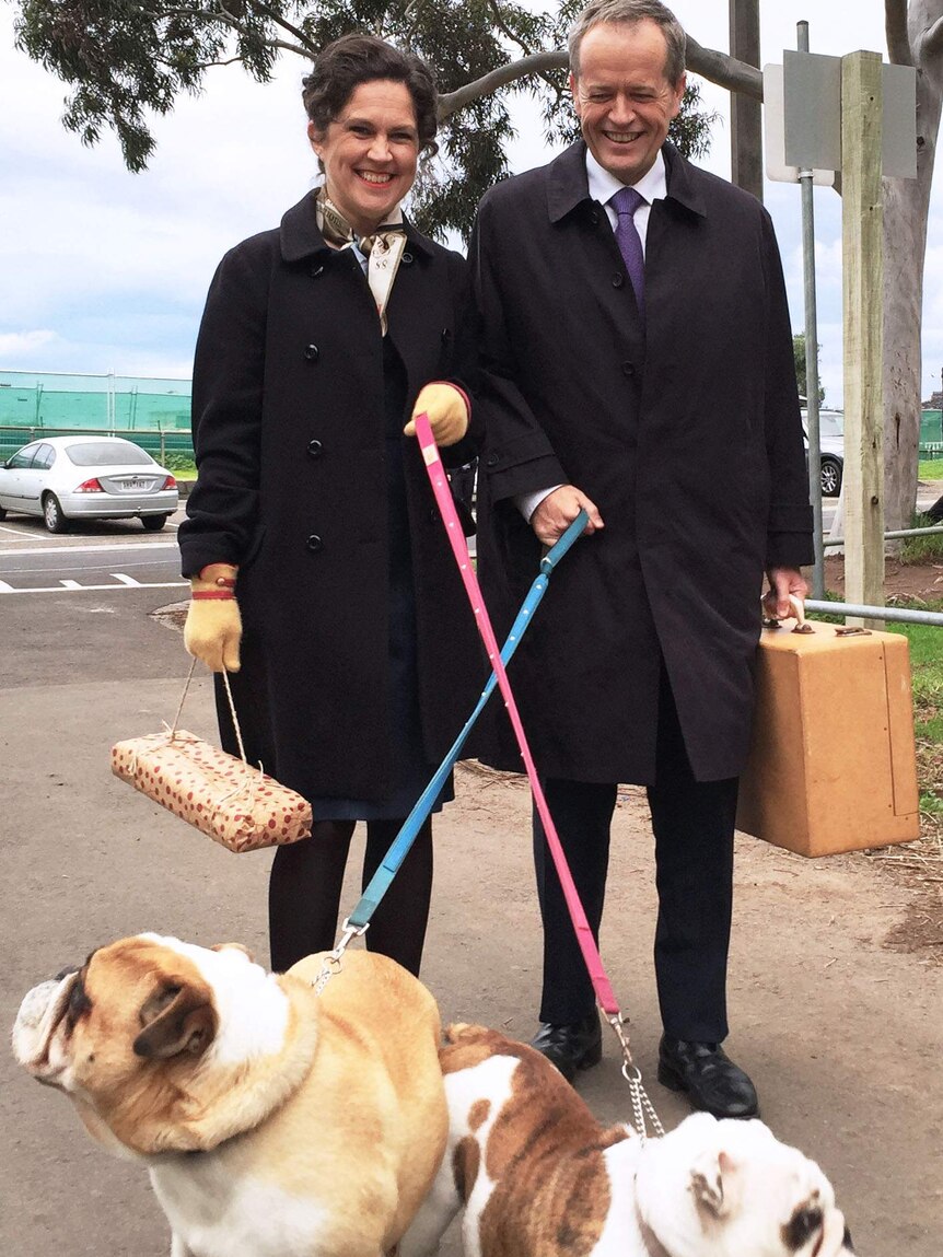 The ABC's Annabel Crabb and Bill Shorten walk two dogs while filming Kitchen Cabinet.