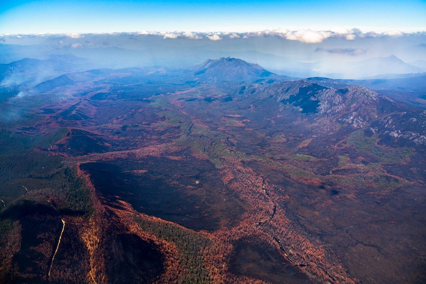 Aerial view of bushfire damage to wilderness in south west Tasmania.