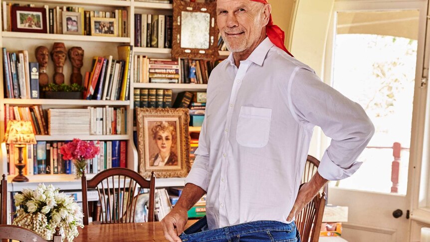 Peter Fitzsimons shows how big his old jeans were.