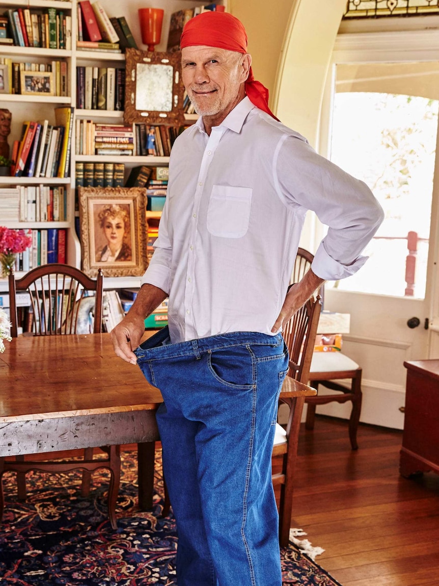 Peter FitzSimons shows how big his old jeans were.