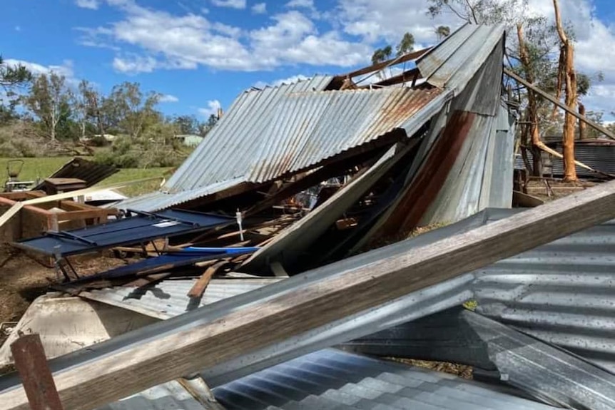 metal roof and building destroyed in storm