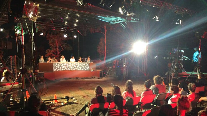 The local kids from Garma Youth Forum test drive the set ahead of ABC's QandA program live broadcast from Garma 2014
