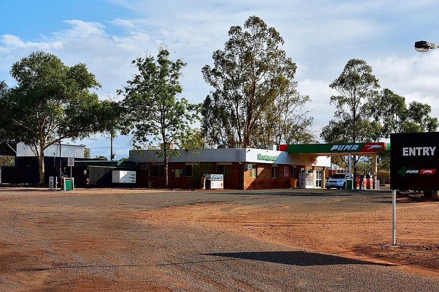 A truck stop with a gravel and dirt driveway