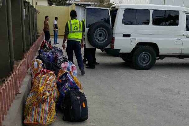 Refugees and asylum seekers arriving at the motel in Port Moresby.