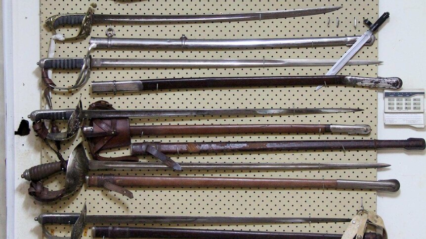 Military swords dating from 1822 hanging in the basement of Leo Walsh's home.