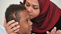 Mohamed El Shazly before surgery with his mother, Ann.