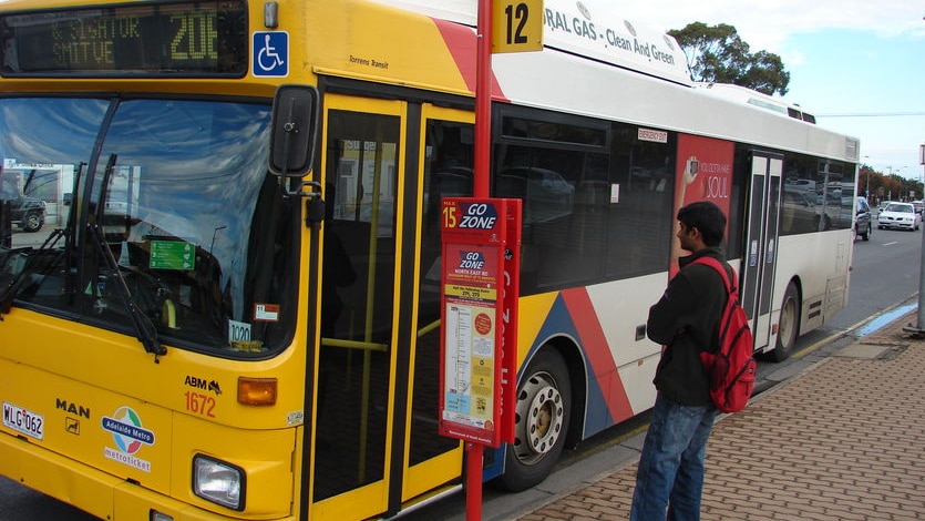 An Adelaide bus at a stop.