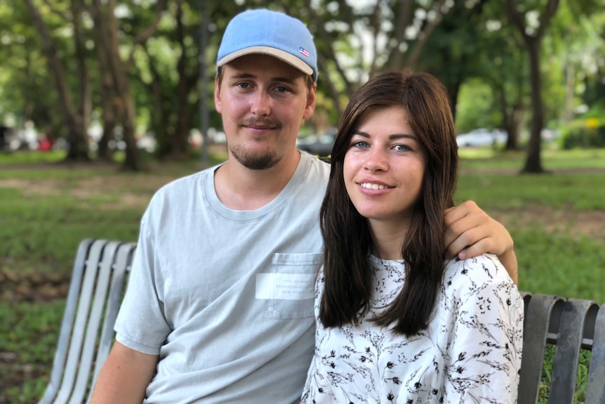 A portrait of Alexander Jensen and Julie Lelund sitting in a park.