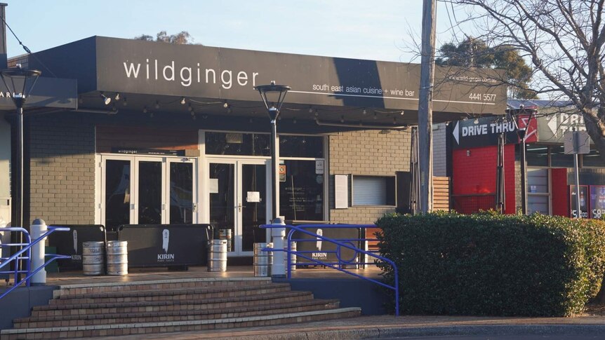 Wildginger restaurant with its doors closed on the main street of Huskisson.
