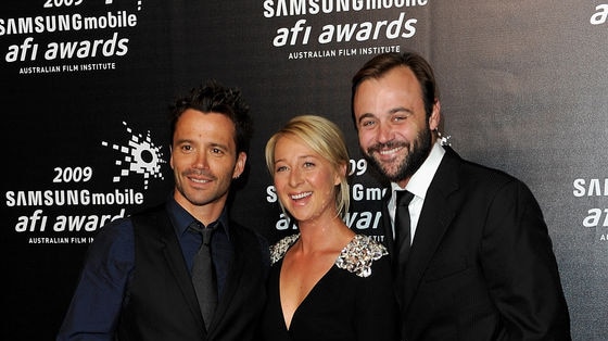 Damien Walshe Howling, Asher Keddie and Gyton Grantley pose on the red carpet