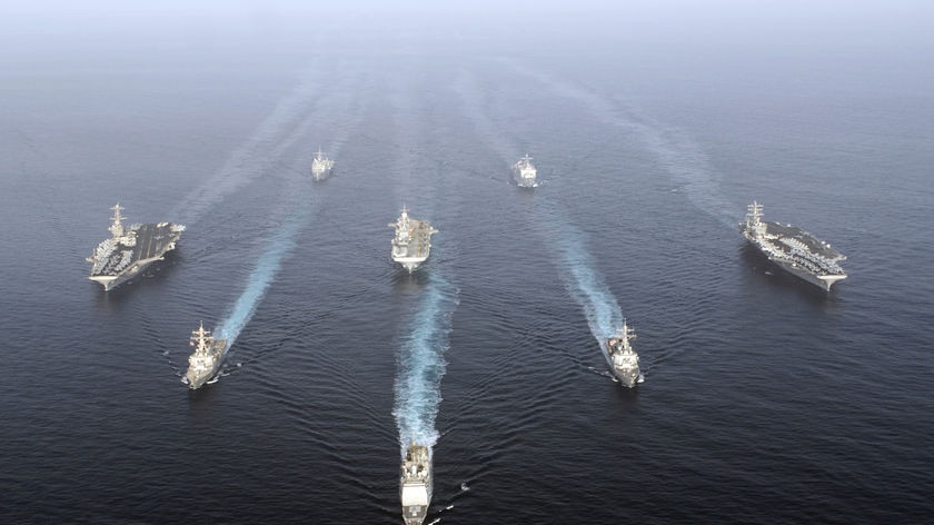 US warships enter the Gulf in a show of force.