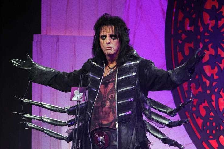 Alice Cooper in full costumer and makeup.