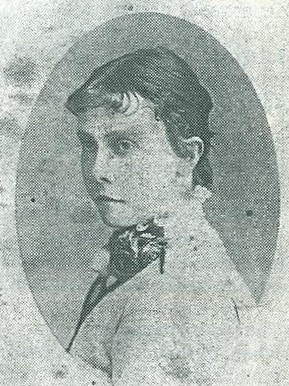 Black and white photo of a woman wearing a shirt and scarf