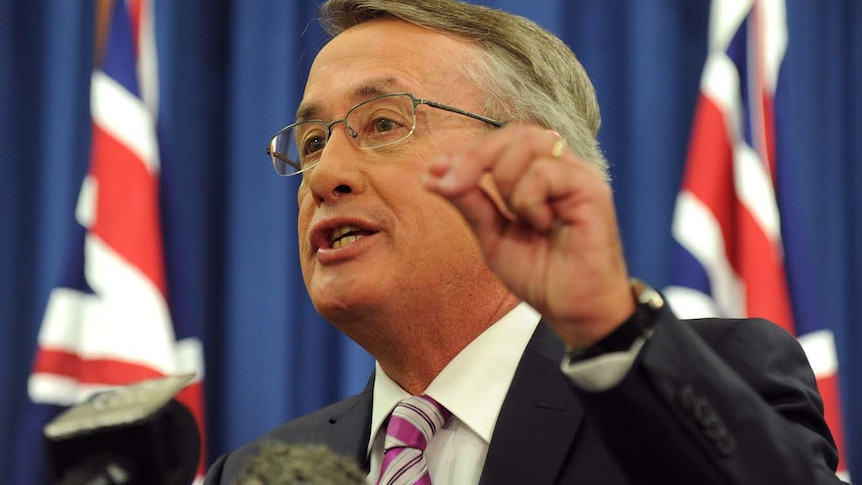 Treasurer Wayne Swan addresses the media during a press conference in Brisbane.