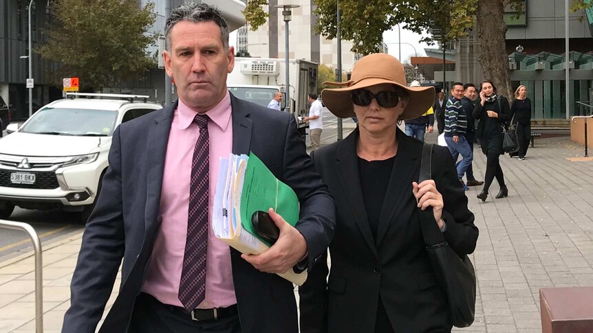 Veronica Theriault leaving court with her lawyer in May 2018.