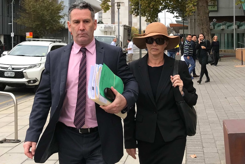 Veronica Theriault leaving court with her lawyer in May 2018.