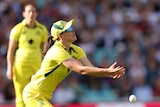 Australia fielder Tahlia McGrath misses a catch as she dives for a ball.