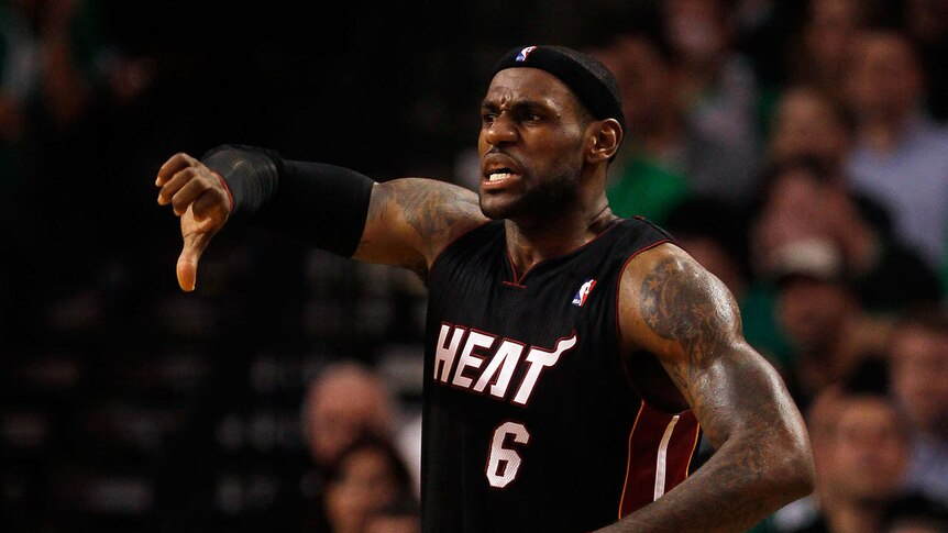 Thumbs down: LeBron's Miami career kicked off with a loss.