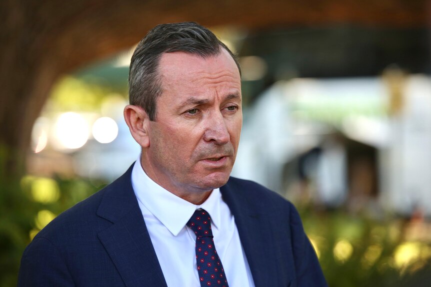 A head and shoulder shot of WA Premier Mark McGowan speaking at an outdoor media conference.