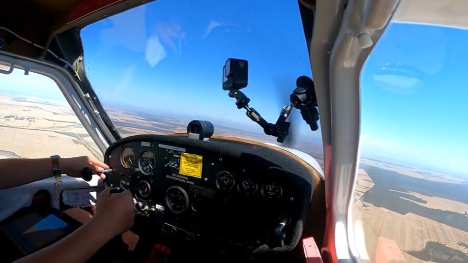 A photo from inside the cockpit of a light aircraft that is being flown over WA.