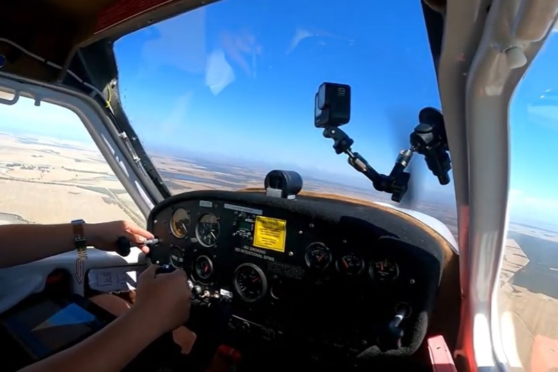 A photo from inside the cockpit of a light aircraft that is being flown over WA.