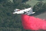Fire retardant dropped on fires and residential houses in Sydney suburb Turramurra