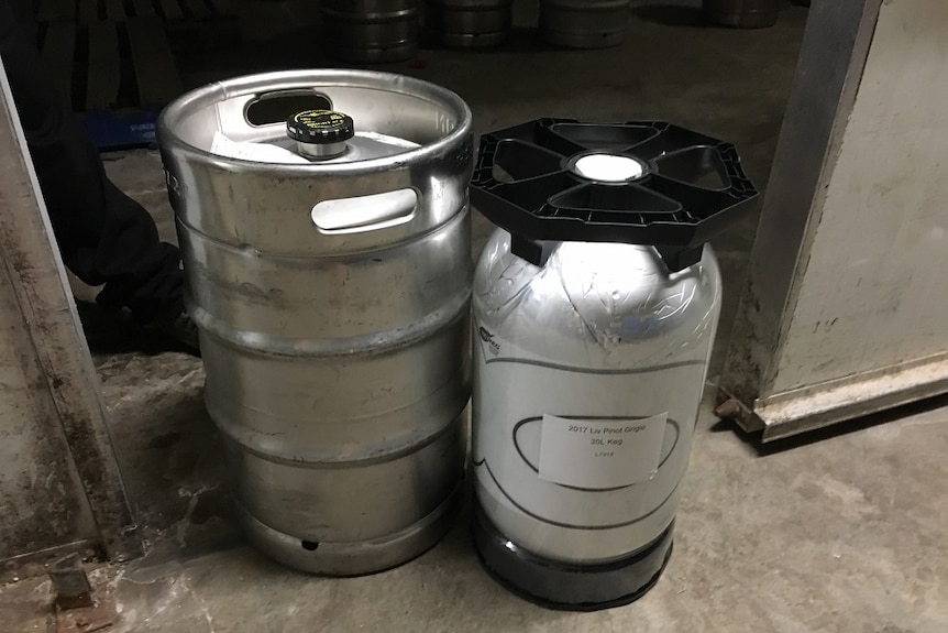 A beer keg sits just outside a cool room next to a 30 litre wine keg