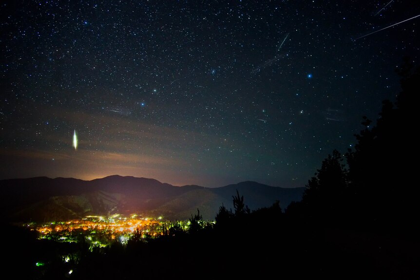 Sky over town of Bright, Victoria with meteors in sky