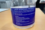 blue label on transparent bottle
