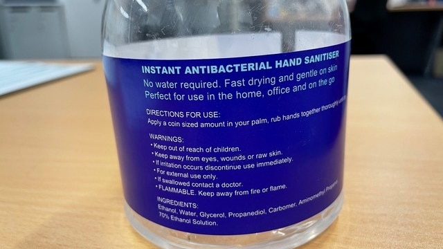 blue label on transparent bottle