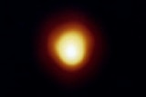 A comparison image of a single red star with a constellation of stars from the mid-1990s.