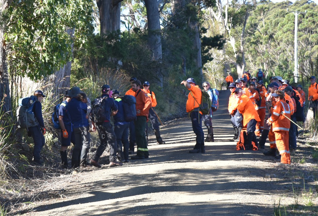 Shayla Phillips in arms of rescuers.